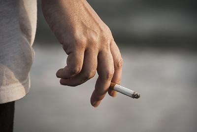 cigarette in persons hand