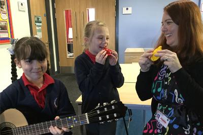 Roman Road Primary School music teacher and pupils