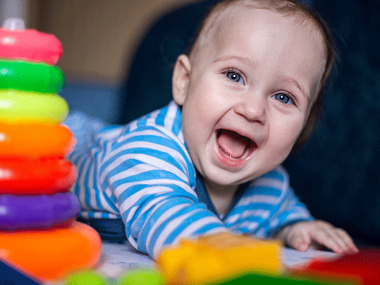 Happy baby playing