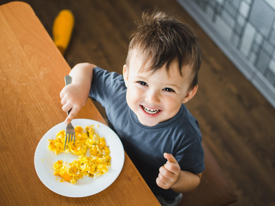 Happy boy eating