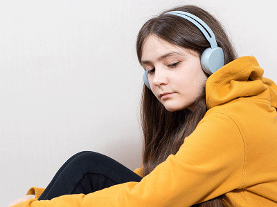 Reflective girl with headphones