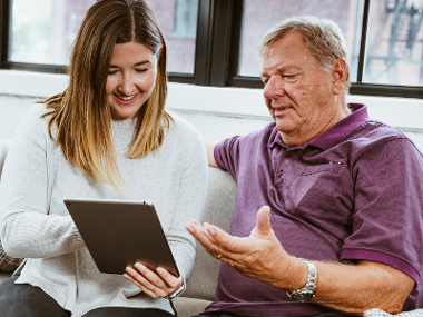 Man and daughter on tablet